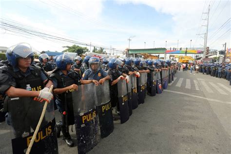 More police pour into Quiboloy base .